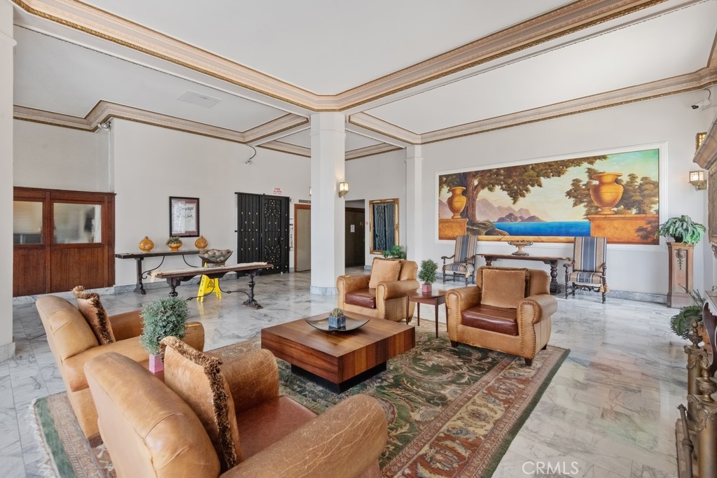 360 West Ocean Boulevard, Unit 706 Long Beach, CA 90802 - Photo 13 of 22 a living room with furniture a large window and a flat screen tv