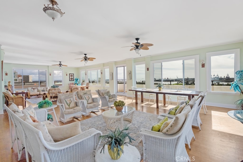 360 West Ocean Boulevard, Unit 706 Long Beach, CA 90802 - Photo 15 of 22 a view of a dining room with furniture a kitchen and chandelier