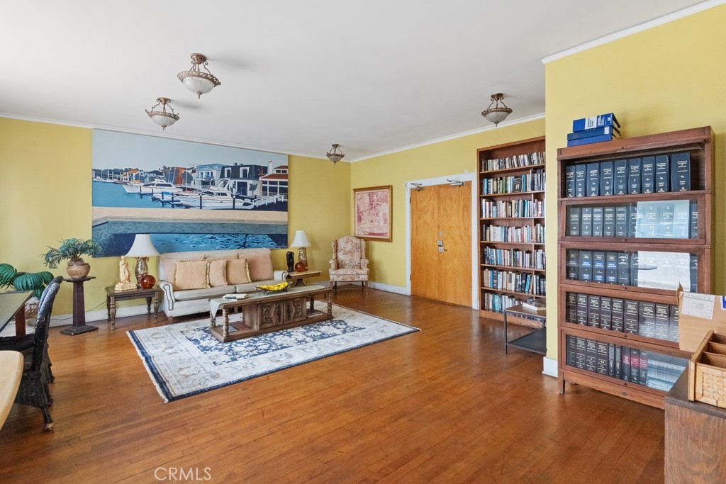 360 West Ocean Boulevard, Unit 706 Long Beach, CA 90802 - Photo 16 of 22 a living room with furniture and a book shelf