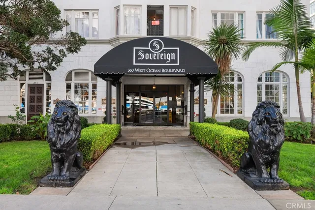 a view of a brick house with a clock on the side