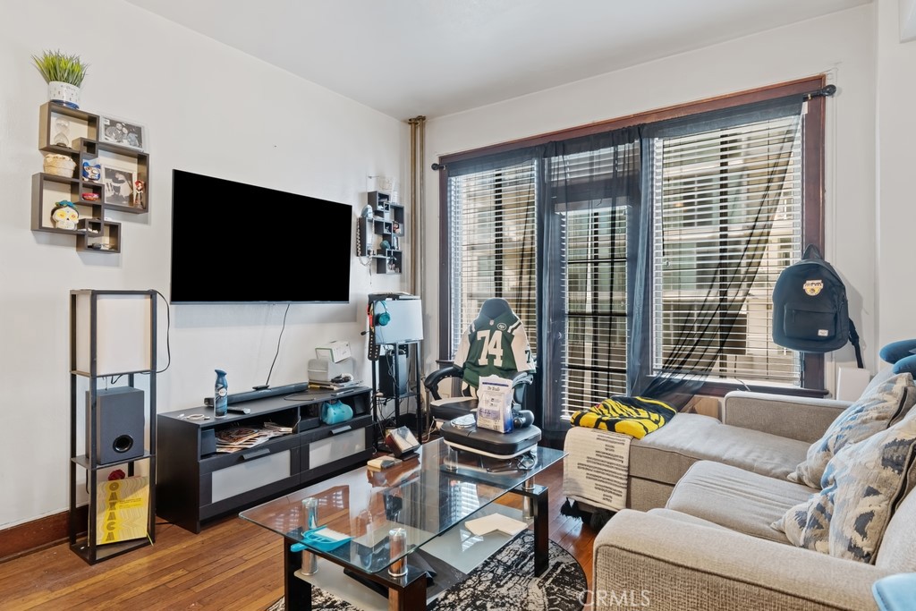 360 West Ocean Boulevard, Unit 706 Long Beach, CA 90802 - Photo 4 of 22 a living room with furniture and a flat screen tv