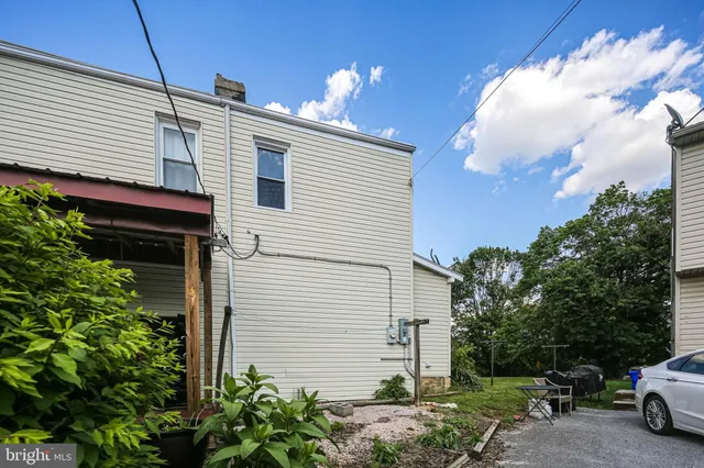 a view of a house with a umbrellas