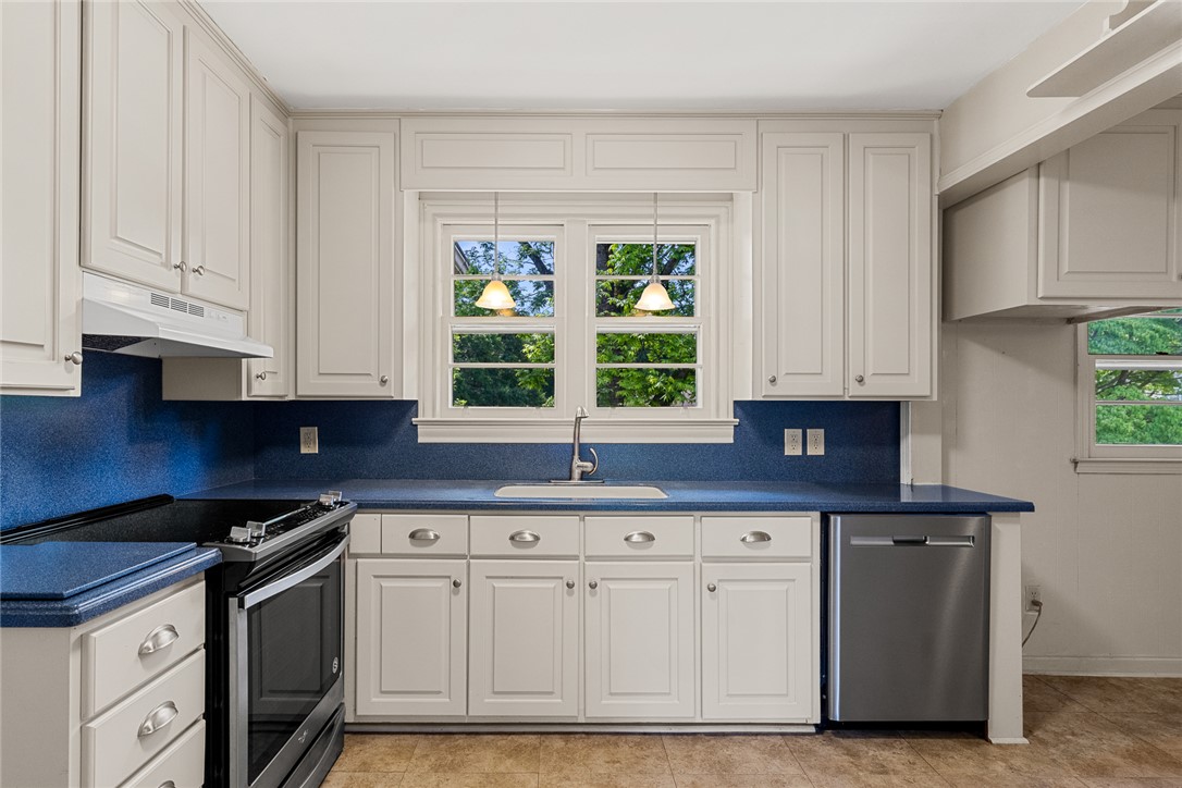 1509 869 Anderson, SC 29621 - Photo 16 of 45 A well-appointed culinary space featuring bright white cabinetry and striking blue countertops.