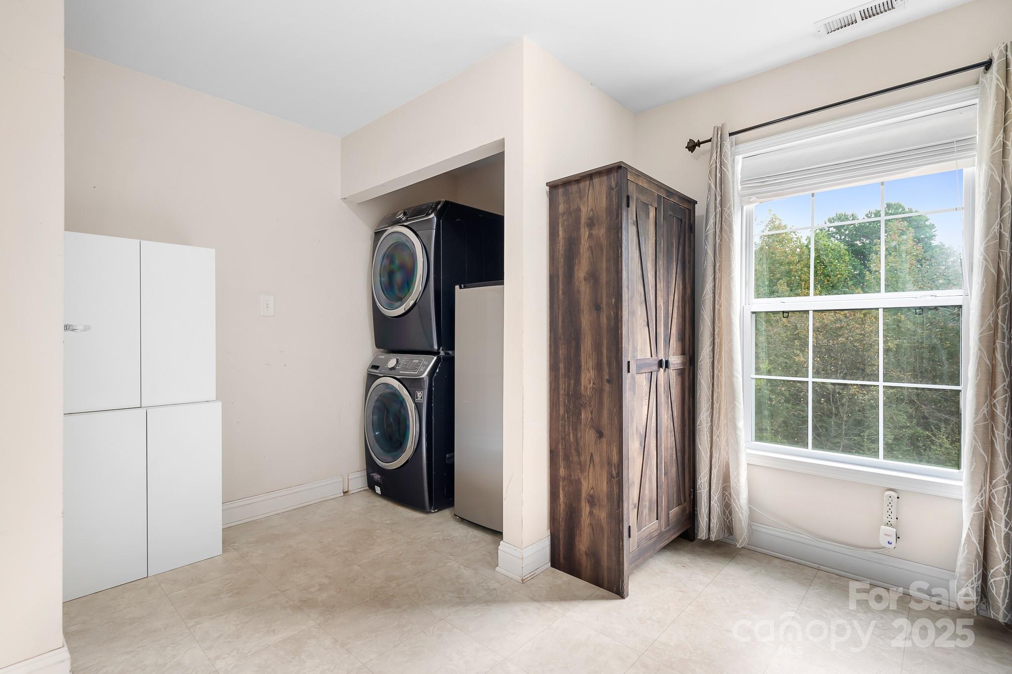 4654 Rocky Hollow Road Davidson, NC 28036 - Photo 18 of 48 a view of a storage & utility room with washer and dryer