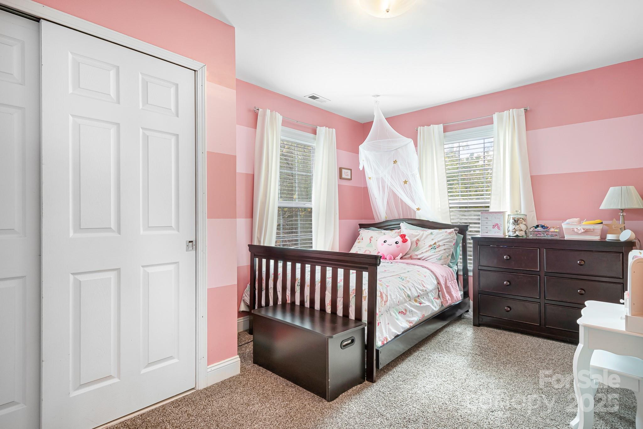 4654 Rocky Hollow Road Davidson, NC 28036 - Photo 19 of 48 a bed room with a bed and a window