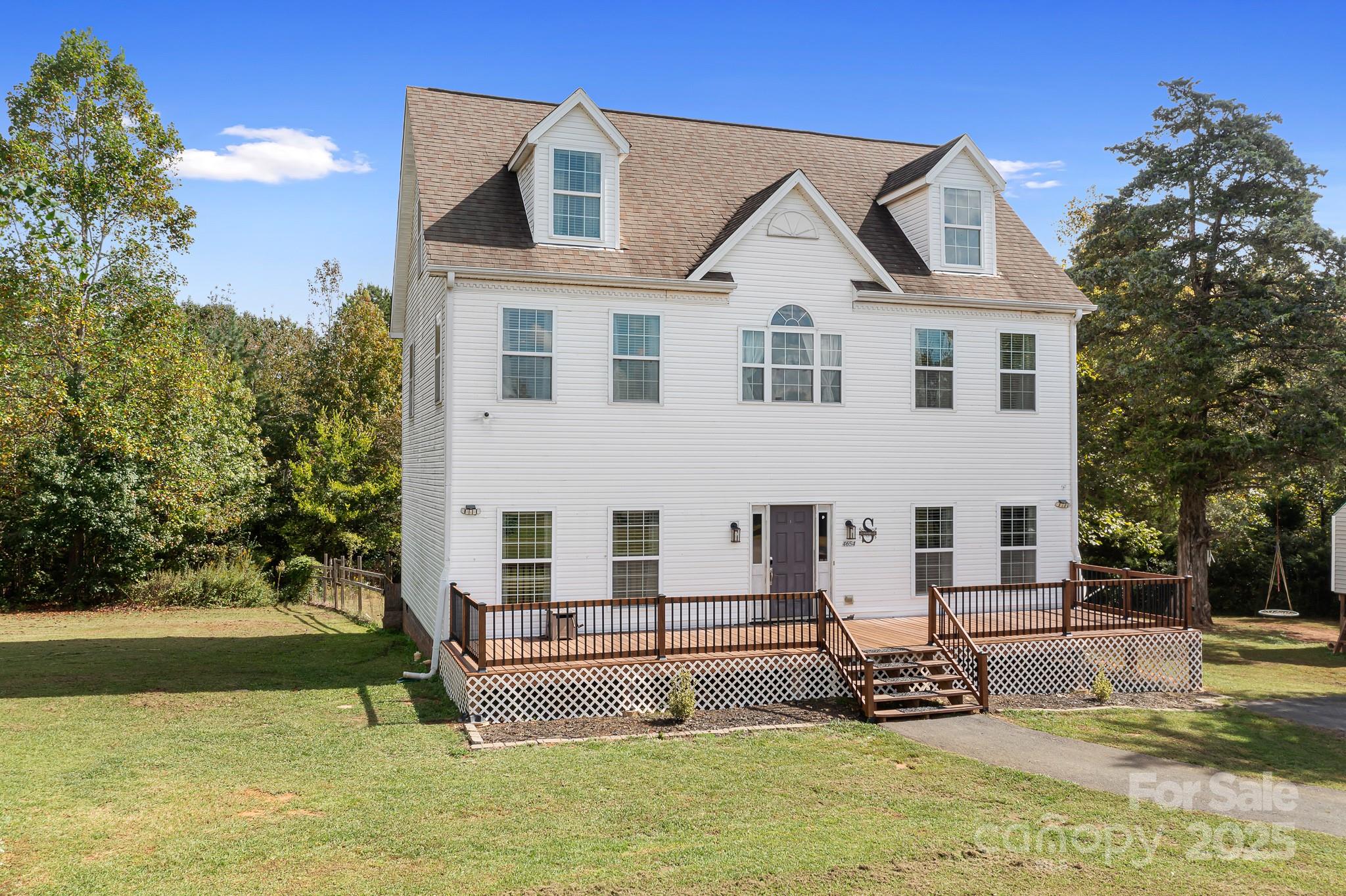 4654 Rocky Hollow Road Davidson, NC 28036 - Photo 2 of 48 a front view of a house with a yard
