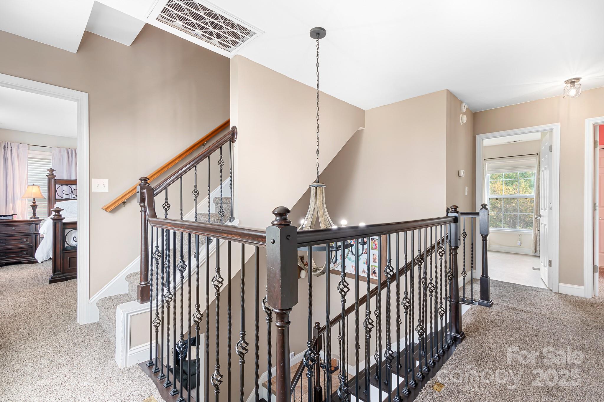 4654 Rocky Hollow Road Davidson, NC 28036 - Photo 22 of 48 a view of staircase with railing and stairs