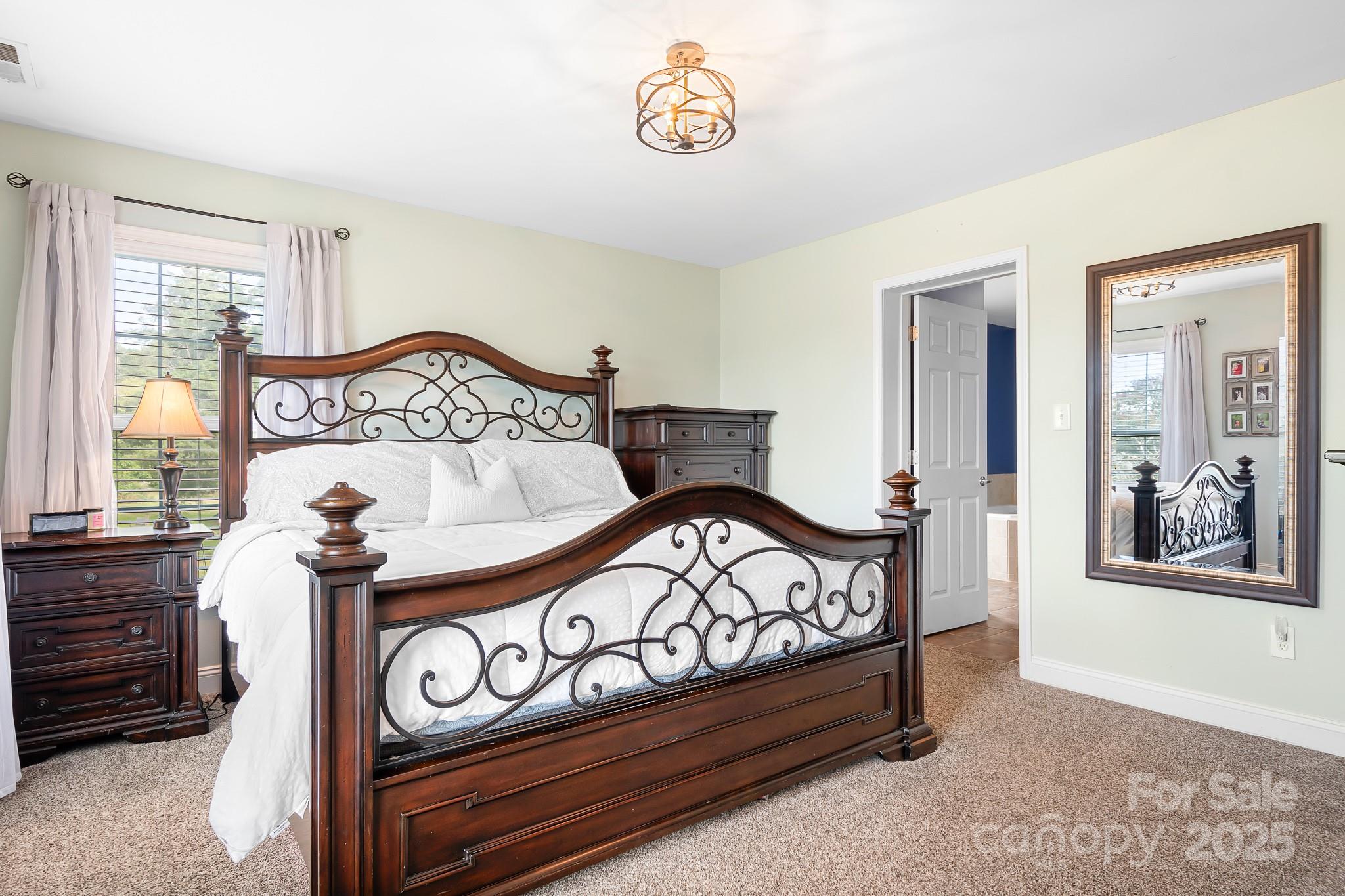 4654 Rocky Hollow Road Davidson, NC 28036 - Photo 23 of 48 a bedroom with a bed and a window