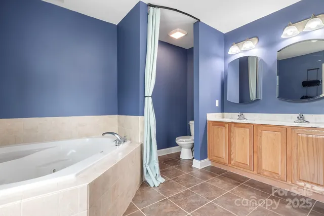 a bathroom with a bathtub and window