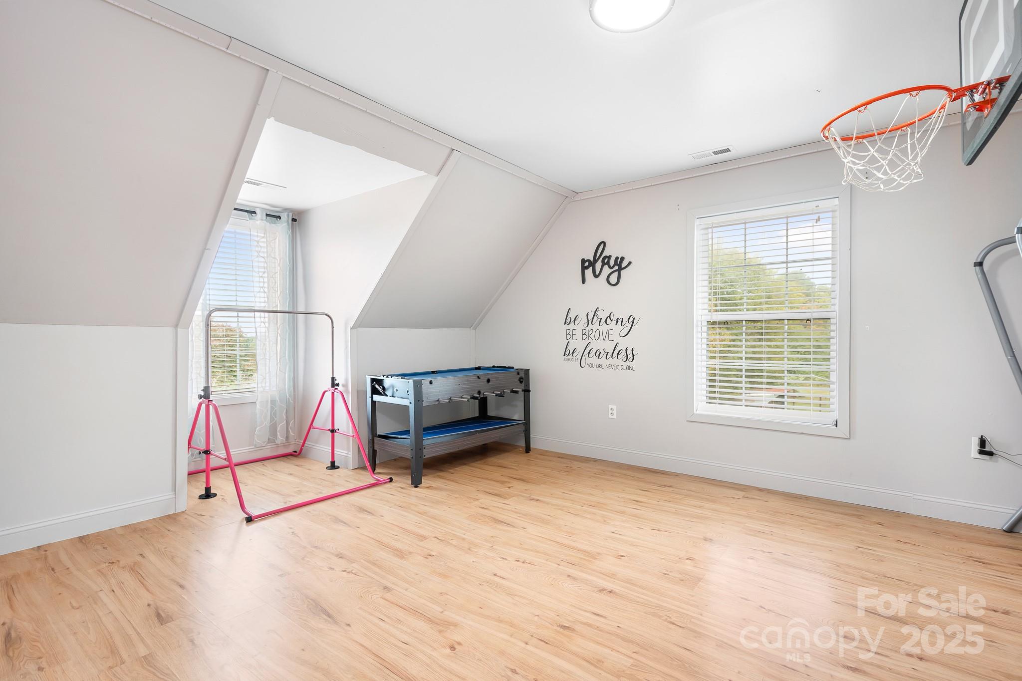 4654 Rocky Hollow Road Davidson, NC 28036 - Photo 27 of 48 a view of empty room with wooden floor and fan