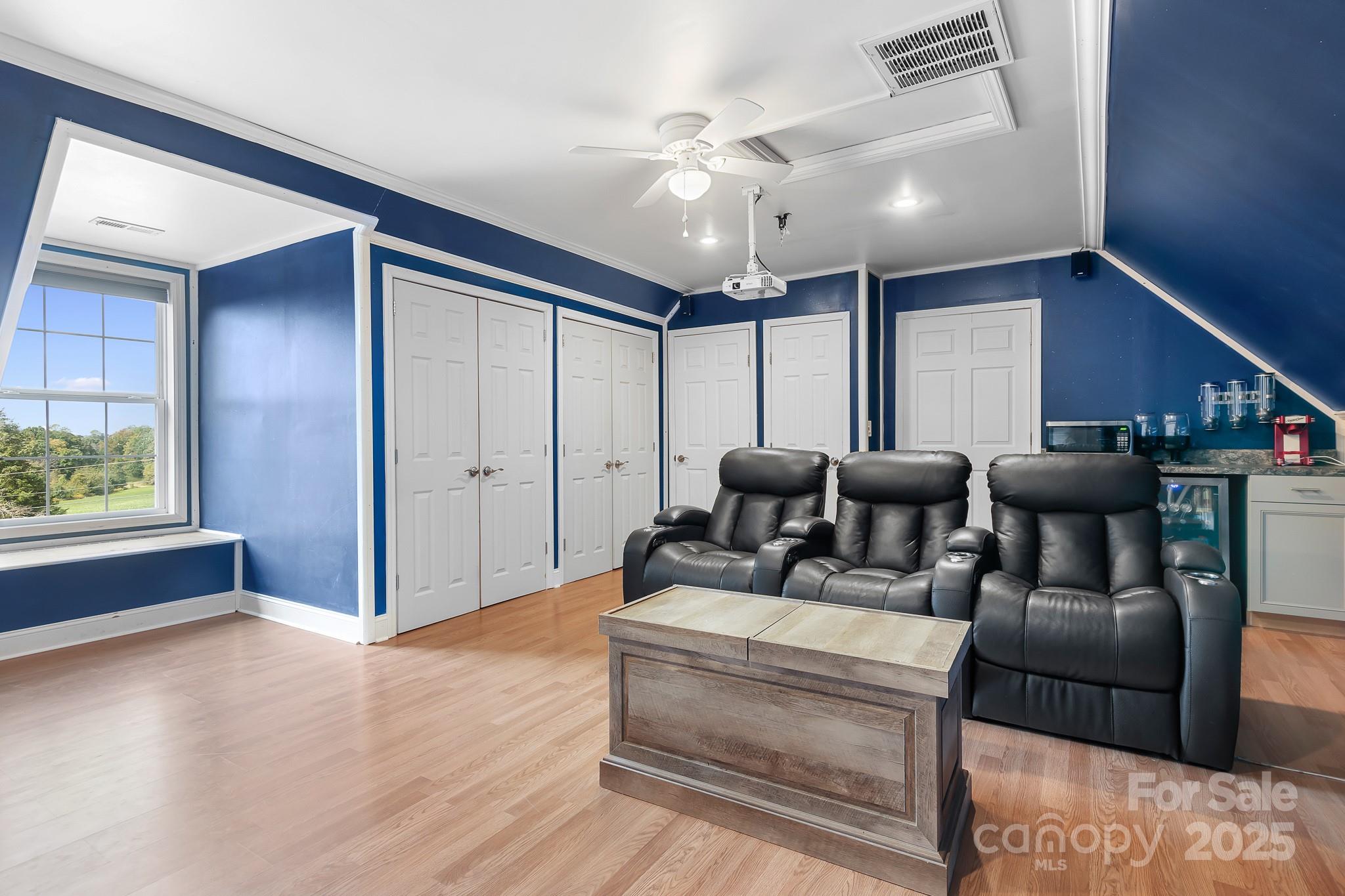 4654 Rocky Hollow Road Davidson, NC 28036 - Photo 29 of 48 a living room with furniture and a chandelier