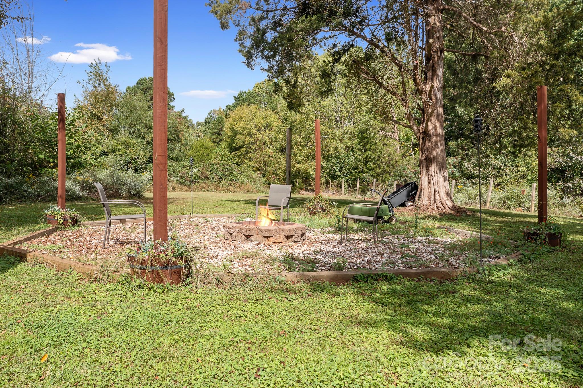 4654 Rocky Hollow Road Davidson, NC 28036 - Photo 36 of 48 a view of a yard with large trees