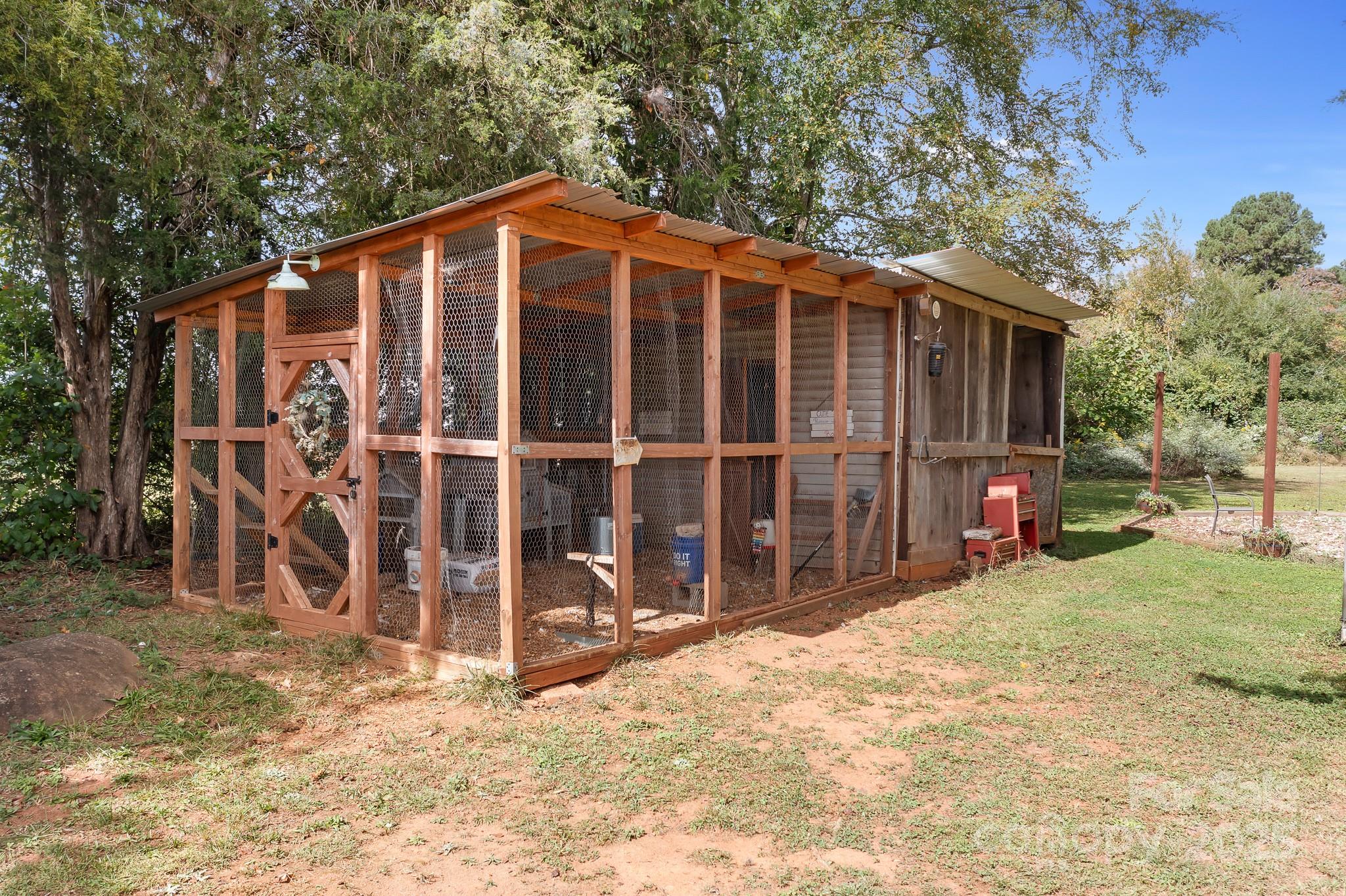 4654 Rocky Hollow Road Davidson, NC 28036 - Photo 41 of 48 a view of a house with a yard