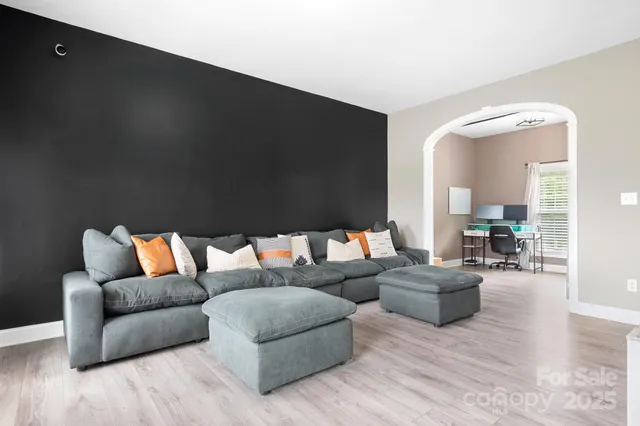 a bedroom with furniture and a window