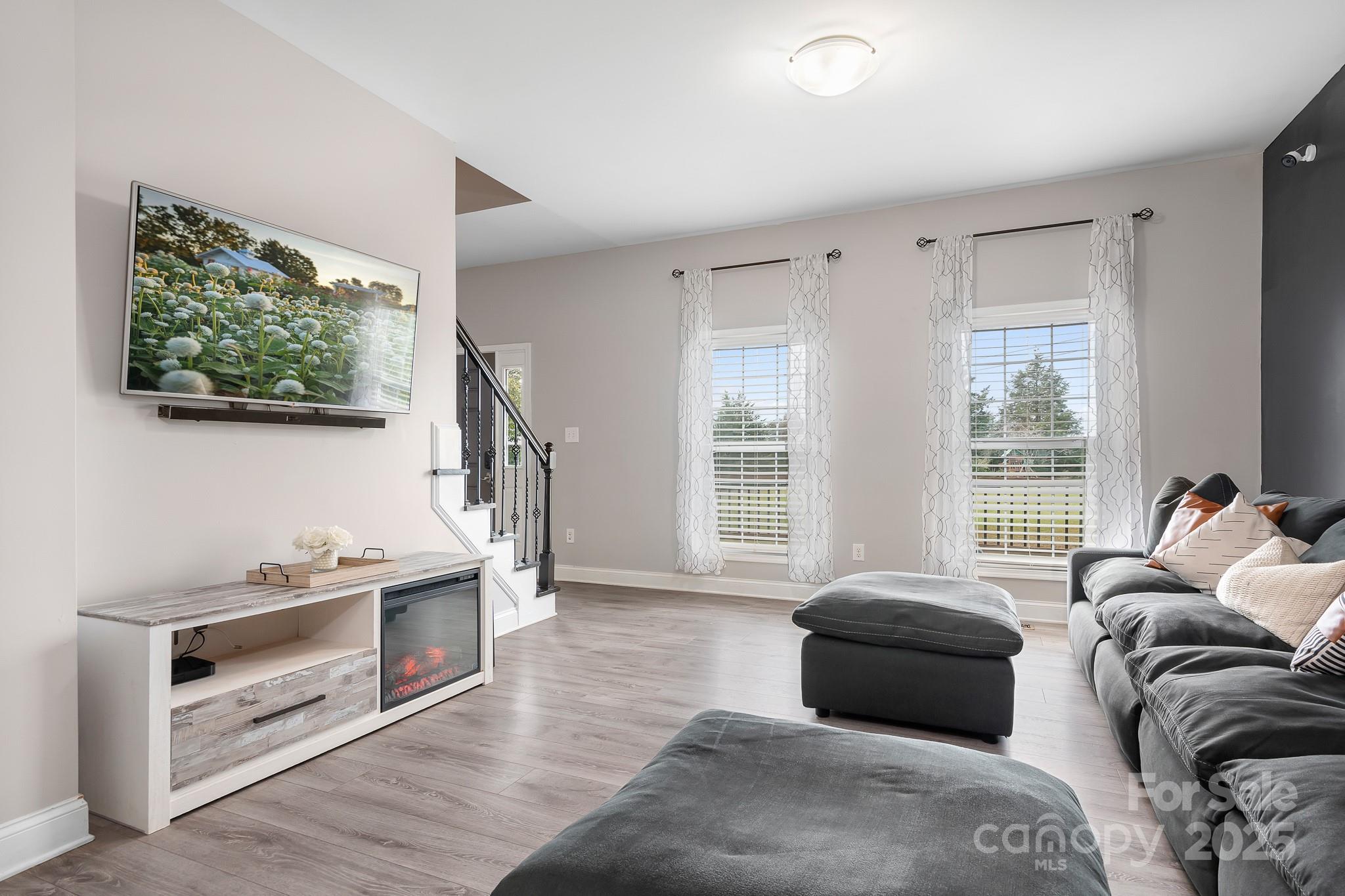 4654 Rocky Hollow Road Davidson, NC 28036 - Photo 8 of 48 a bedroom with furniture and a window