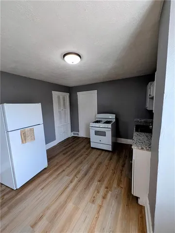 a room with furniture and wooden floor