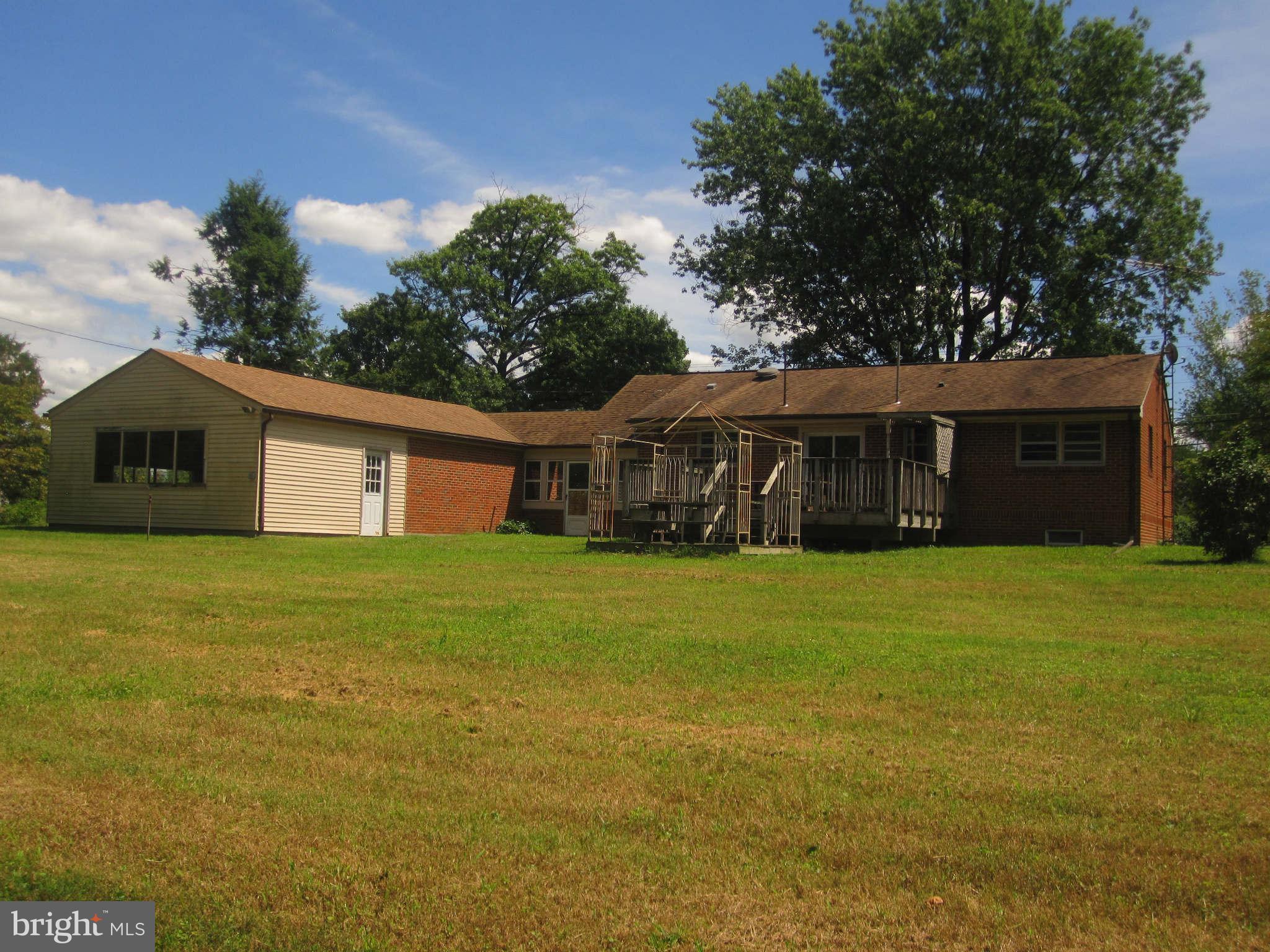 7204 Bowers Road Frederick, MD 21702 - Photo 20 of 26 a front view of a house with a garden