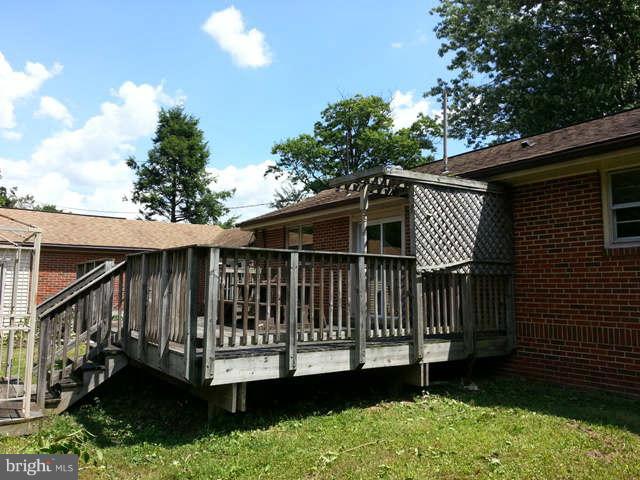 7204 Bowers Road Frederick, MD 21702 - Photo 23 of 26 a view of a house with a yard and a deck