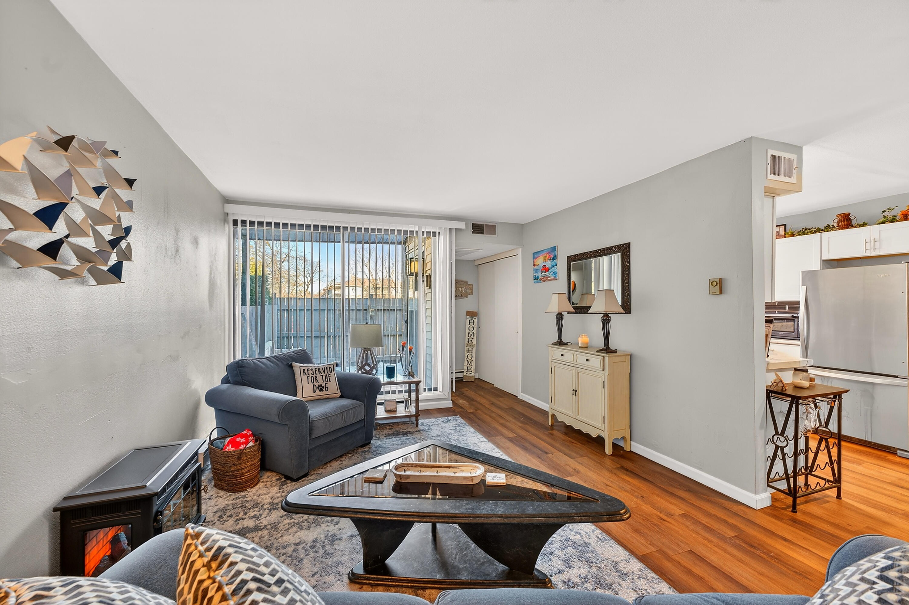 8305 North 107th Street, Unit F Milwaukee, WI 53224 - Photo 4 of 22 Open sightlines from living room to kitchen.