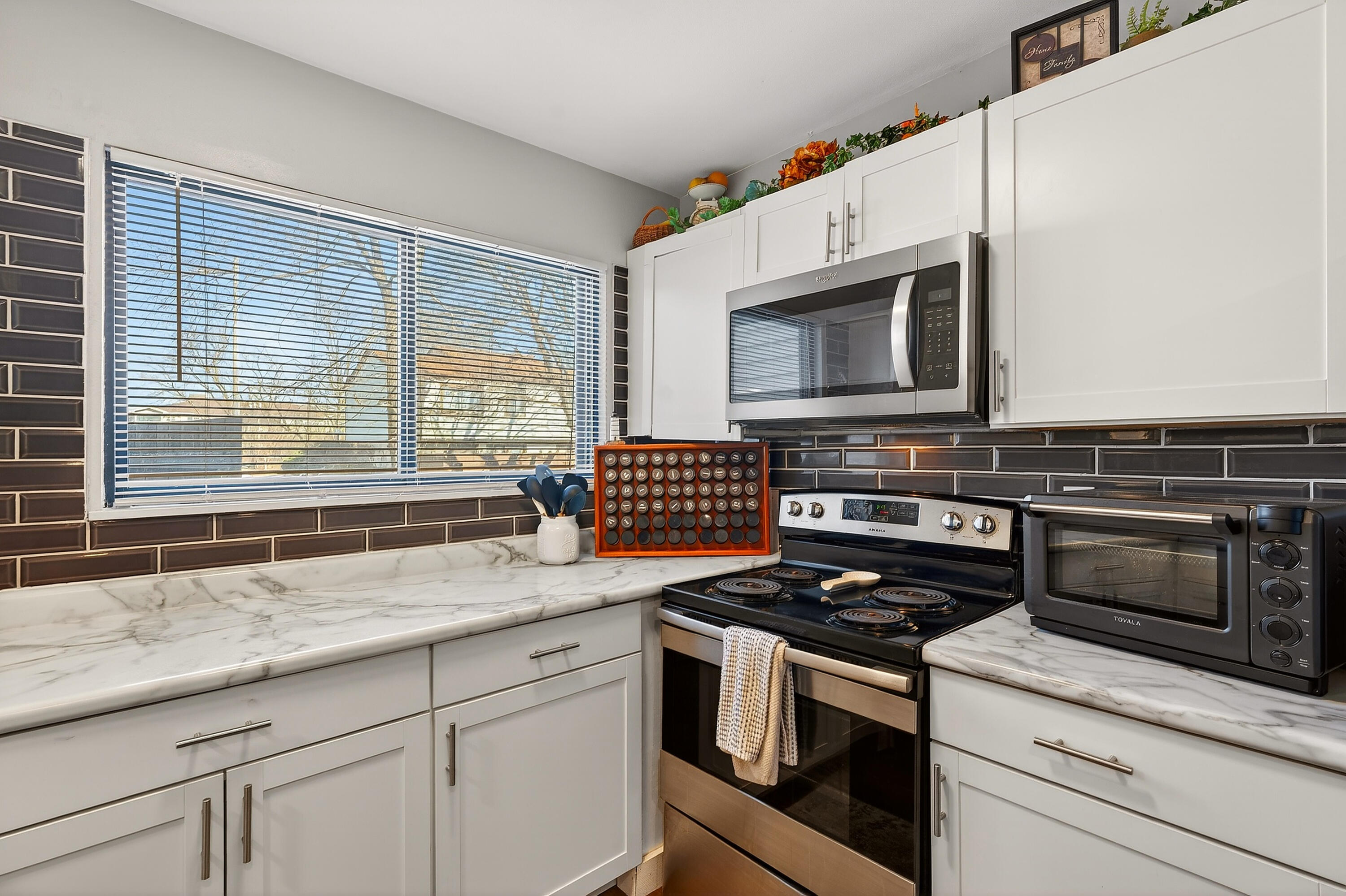 8305 North 107th Street, Unit F Milwaukee, WI 53224 - Photo 7 of 22 Generous prep space with bright window views.