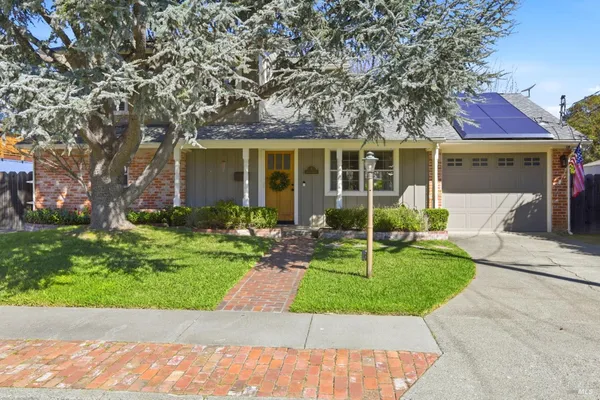 front view of a house with a yard