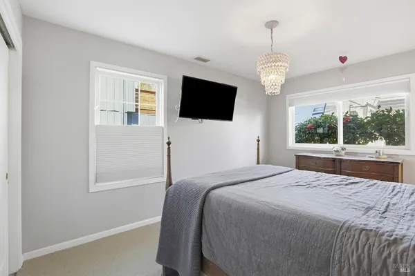a bedroom with a bed and dresser
