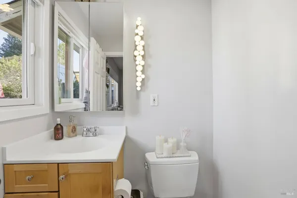 a view of a patio with table and chairs and potted plants