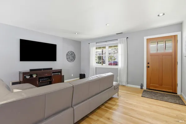 a living room with furniture and a large window
