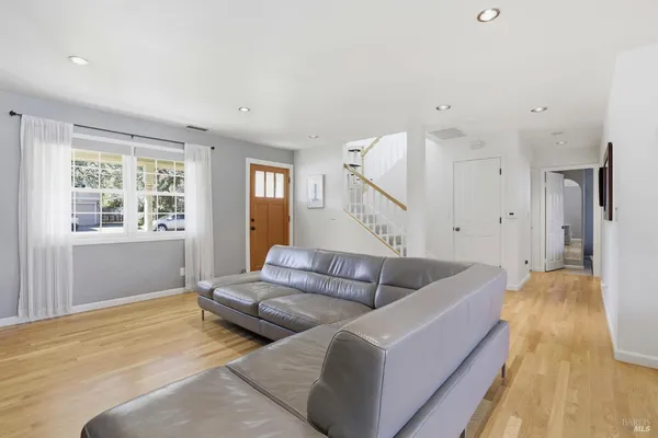 a kitchen with stainless steel appliances granite countertop a sink a stove and a refrigerator