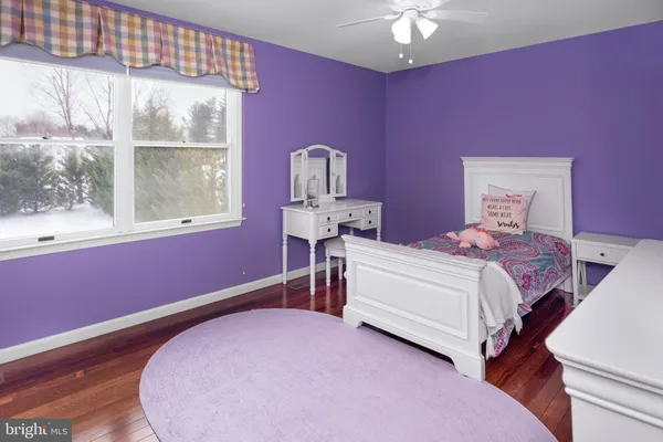 a bed room with a bed and a window
