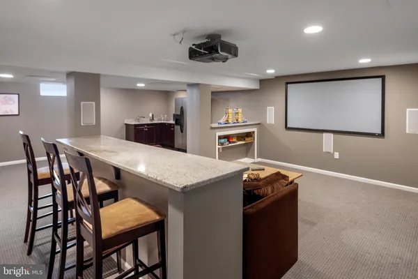 a kitchen with a table and chairs in it