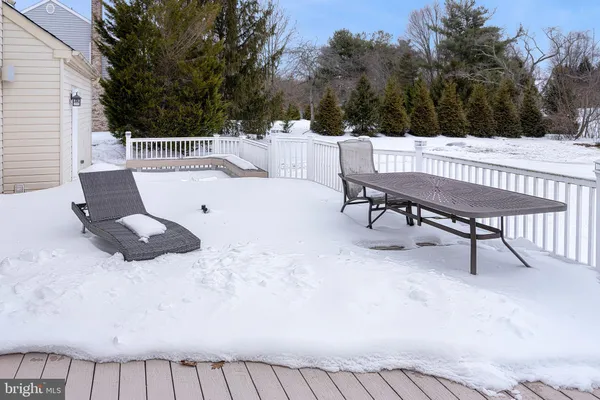 a view of a patio with a table and chairs