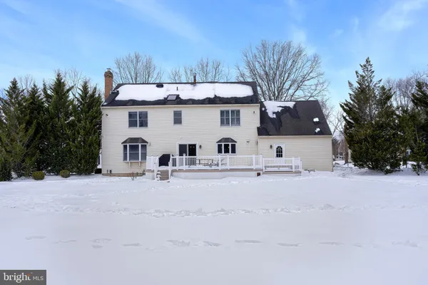 a view of a house with a snow in the yard