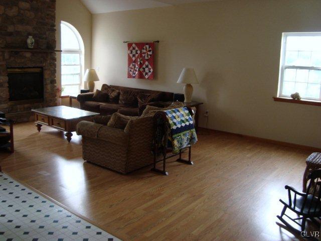 774 Bushkill Center Road Nazareth, PA 18064 - Photo 16 of 36 a living room with hard wood flooring and a couch