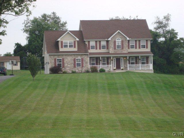 774 Bushkill Center Road Nazareth, PA 18064 - Photo 2 of 36 a front view of a house with a garden and plants