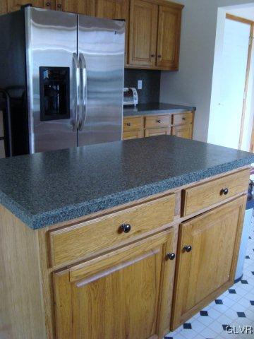 774 Bushkill Center Road Nazareth, PA 18064 - Photo 22 of 36 a kitchen with granite countertop a refrigerator and a sink