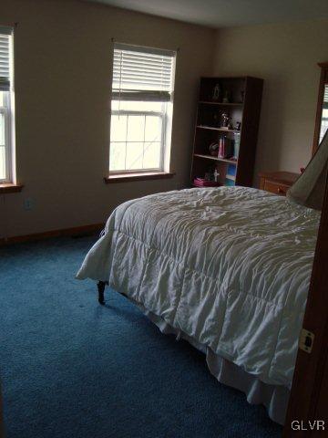 774 Bushkill Center Road Nazareth, PA 18064 - Photo 27 of 36 a bed sitting in a bedroom next to a window