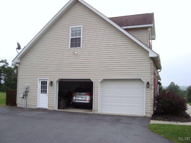 774 Bushkill Center Road Nazareth, PA 18064 - Photo 7 of 36 a view of a house with a garage