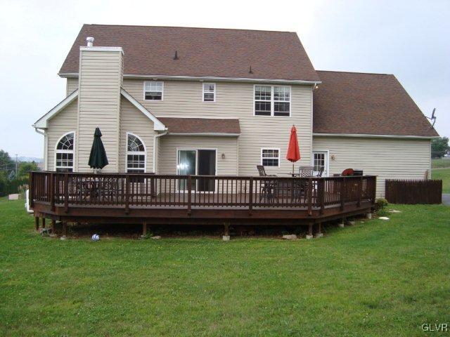 774 Bushkill Center Road Nazareth, PA 18064 - Photo 9 of 36 a view of a house with a wooden deck and a yard