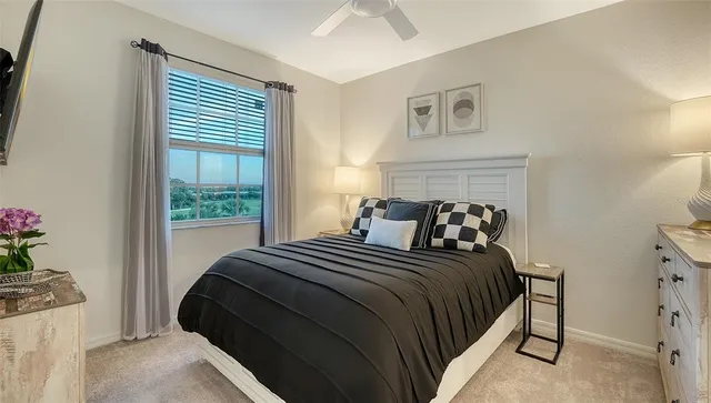 a front view of a house with a yard and potted plants