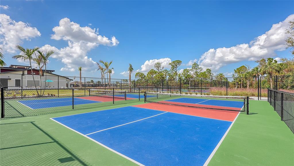 12140 Wellen Golf Street, Unit 301 Venice, FL 34293 - Photo 47 of 85 a view of an outdoor space and tennis court