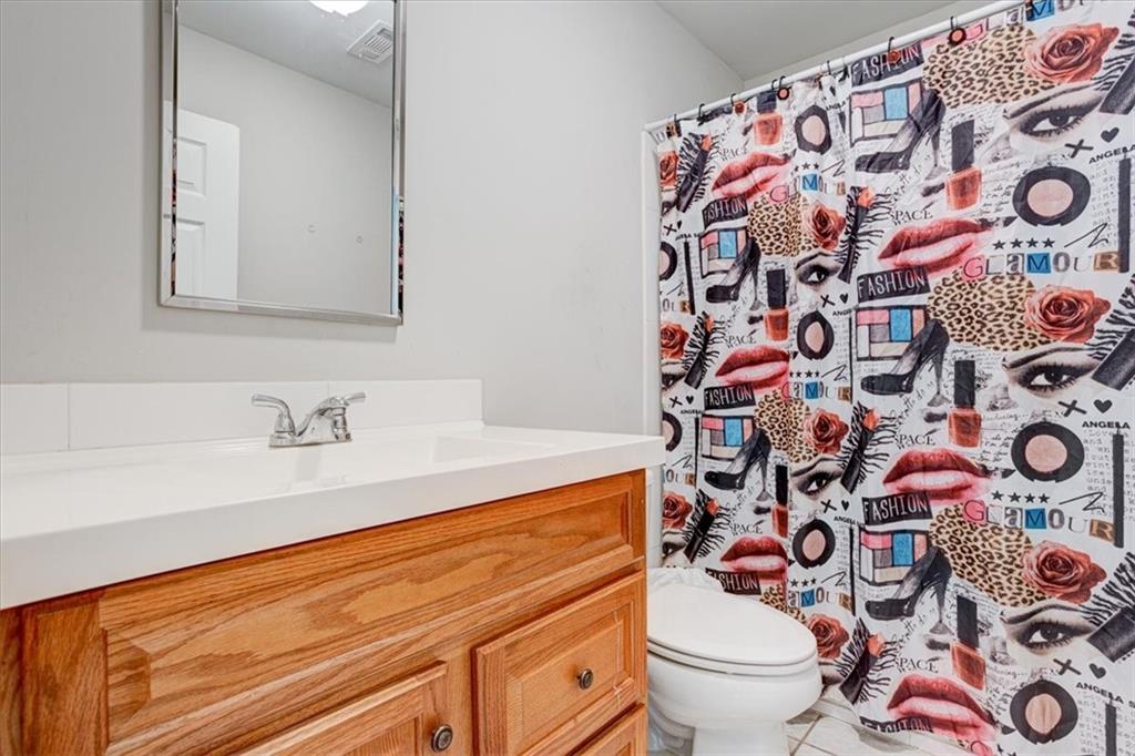 174 Rivertown Road Fairburn, GA 30213 - Photo 20 of 33 a bathroom with a sink and toilet