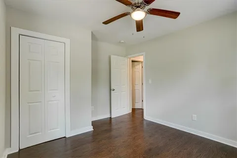a bedroom with a bed and a flat tv screen