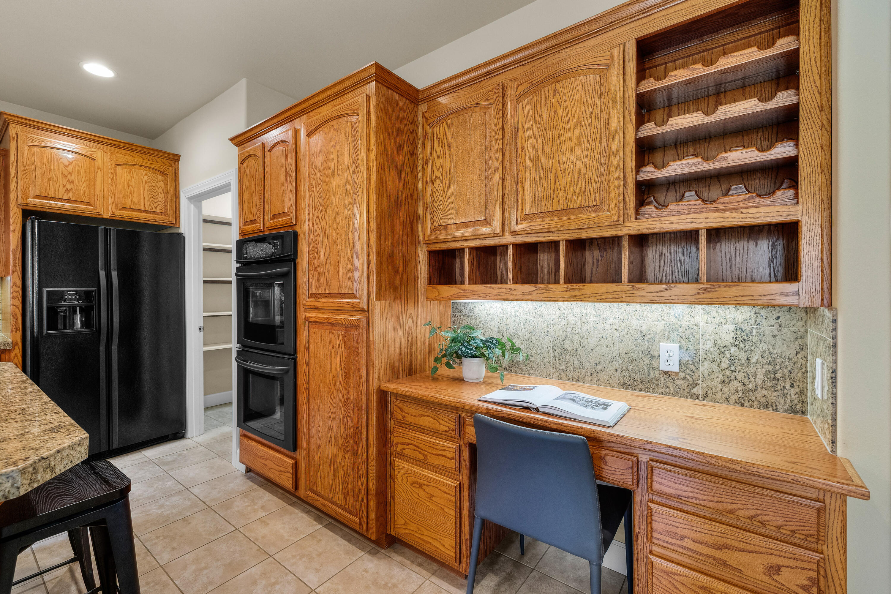 19598 Green Lakes Loop Bend, OR 97702 - Photo 20 of 89 a kitchen with a sink and a refrigerator