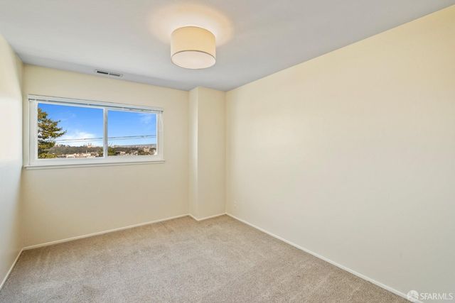 a view of a kitchen with an empty space