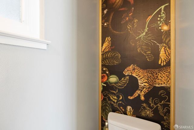 a toilet with a shower curtain