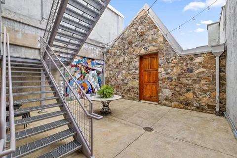 a view of hallway with wooden floor