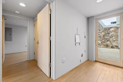 a view of room with wooden floor and window