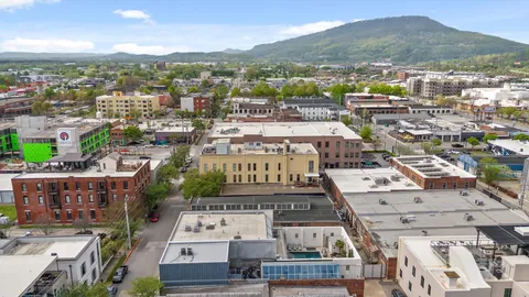 a view of city with ocean