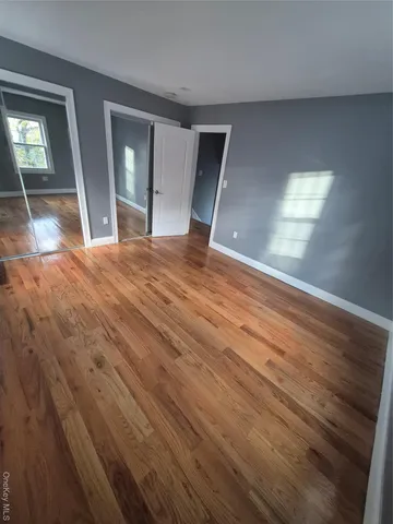 view of empty room with wooden floor